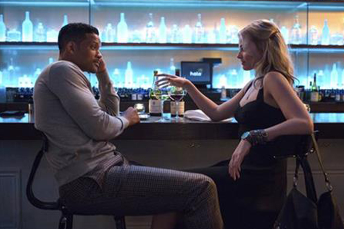 In this image released by Warner Bros. Pictures, Will Smith and Margot Robbie, right, appear in a scene from Focus. (AP Photo/Warner Bros. Pictures)