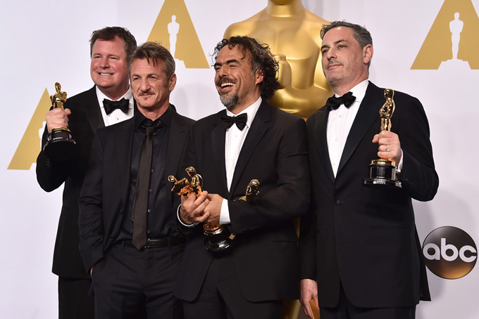 James W. Skotchdopole,  from left, Sean Penn, Alejandro Gonzalez Inarritu and John Lesher pose in the press room with the awards for best picture and best director for Birdman" at the Oscars on Sunday, Feb. 22, 2015, at the Dolby Theatre in Los Angeles. (Photo by Jordan Strauss/Invision/AP)