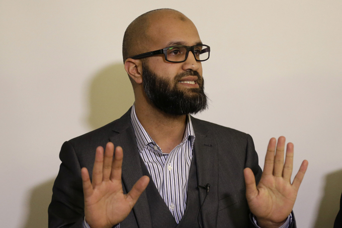 CAGE research director, Asim Qureshi talks during a press conference held by the CAGE human rights charity in London, Thursday, Feb. 26, 2015. A British-accented militant who has appeared in beheading videos released by the Islamic State group in Syria bears “striking similarities” to a man who grew up in London, a Muslim lobbying group said Thursday. Mohammed Emwazi has been identified by news organizations as the masked militant more commonly known as “Jihadi John.” London-based CAGE, which works with Muslims in conflict with British intelligence services, said Thursday its research director, Asim Qureshi, saw strong similarities, but because of the hood worn by the militant, “there was no way he could be 100 percent certain.” (AP Photo/Matt Dunham)