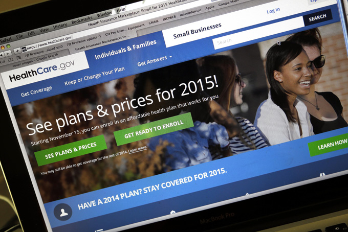 In this Nov. 12, 2014 file photo, the HealthCare.gov website is seen in Portland, Ore. (AP Photo/Don Ryan)