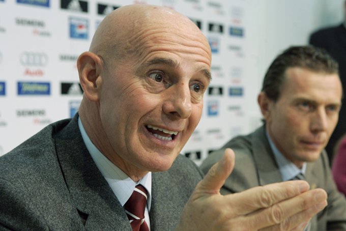In this Dec. 23, 2004 file photo, former Italy coach Arrigo Sacchi, left, speaks with journalists during a press conference at the Bernabeu stadium in Madrid. (AP Photo/Paul White, file)