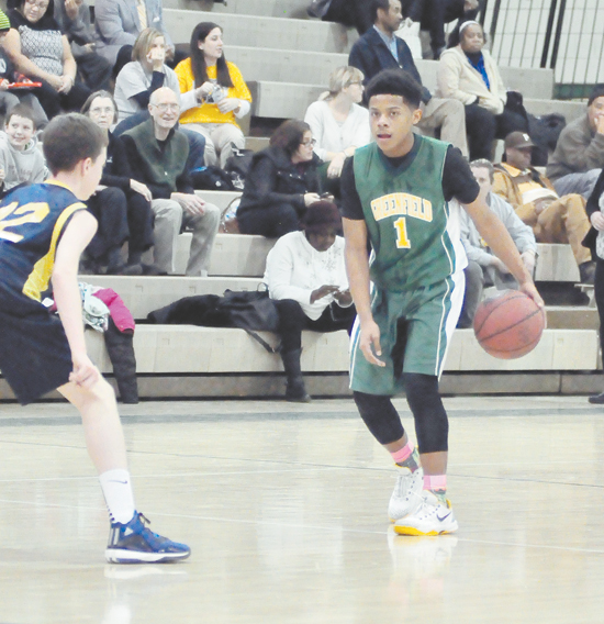 MAURICE COLE of Greenfield looks to make a move against Colfax in the City League Middle School championship game, Cole scored 10 points in the Gators 32-29 win
