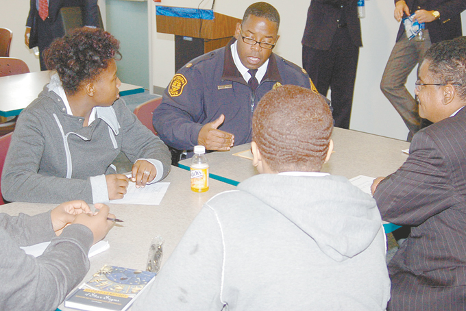 MENTORING THE YOUTH—Eric L. Holmes, commander of Zone 2 station in the Hill District, addressing questions. (Photos by Rossano P. Stewart)