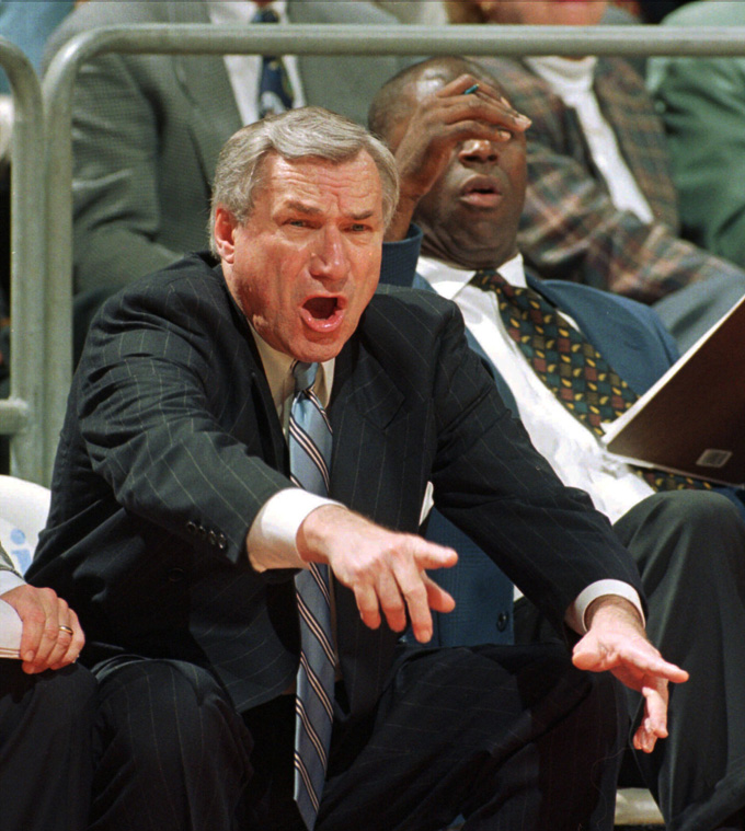 In a Jan. 22, 1997 file photo, North Carolina head coach Dean Smith yells at his players during ACC basketball action against Florida State in Tallahassee, Fla. Smith, the North Carolina basketball coaching great who won two national championships, died "peacefully" at his home Saturday night, Feb. 7, 2015, the school said in a statement Sunday from Smith's family. He was 83.  (AP Photo/Phil Coale, File)