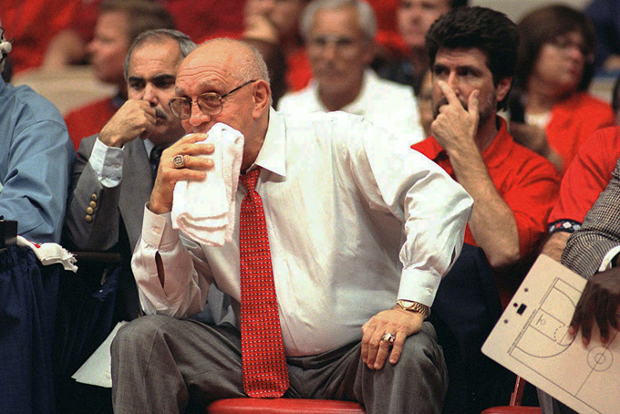 In this Nov. 15, 1995, file photo, Fresno State coach Jerry Tarkanian watches his team play Weber State during the preseason NIT in Fresno, Calif. (AP Photo/Thor Swift, File)