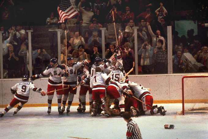 In this Feb. 22, 1980 file photo, the U.S. hockey team pounces on goalie Jim Craig after a 4-3 victory against the Soviets in the 1980 Olympics, as a flag waves from the partisan Lake Placid, N.Y. crowd. It’s been more than three decades since his landmark goal became the centerpiece of the U.S. Olympic hockey team’s Miracle on Ice. For 60-year-old Mike Eruzione, it still seems like only yesterday. (AP Photo, File)