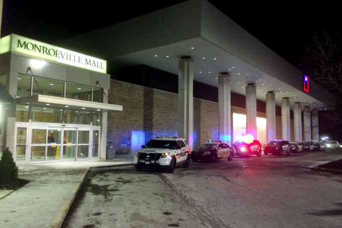 Police vehicles line up outside Monroeville (Pa) Mall Saturday, Feb. 7 2015, after a shooting took place inside. As many as three people were injured. It was unclear whether the shooter was captured or had escaped, said Monroeville Mayor Gregory Erosenko, who had only sketchy details shortly after the 7:45 p.m. shooting. He said his police chief was at the scene. (AP Photo/Pittsburgh Post-Gazette, Bill Wade)