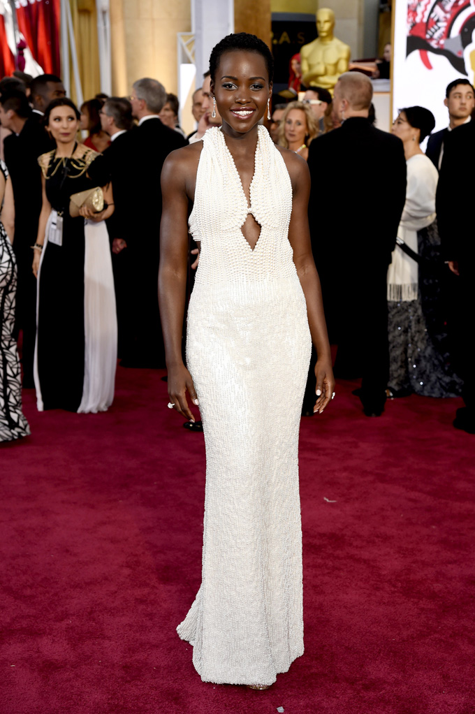 In this Feb. 22, 2015 file photo, actress Lupita Nyong'o arrives at the Oscars wearing a dress made of pearls at the Dolby Theatre in Los Angeles.  Los Angeles sheriff's detectives are investigating the theft of the $150,000 custom Calvin Klein dress worn by Nyong'o at the 2015 Academy Awards. The dress was reported stolen from Nyong'o's West Hollywood hotel room late on Wednesday Feb. 25, 2015. (Photo by Chris Pizzello/Invision/AP, File)