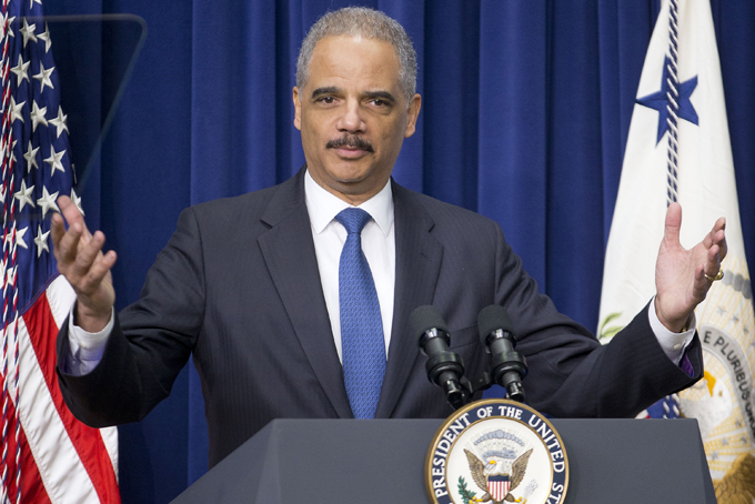 In this Feb. 11, 2015 file photo, Attorney General Eric Holder speaks to law enforcement officers and guests in the Old Executive Office Building on the White House Complex in Washington.  (AP Photo/Pablo Martinez Monsivais, File)