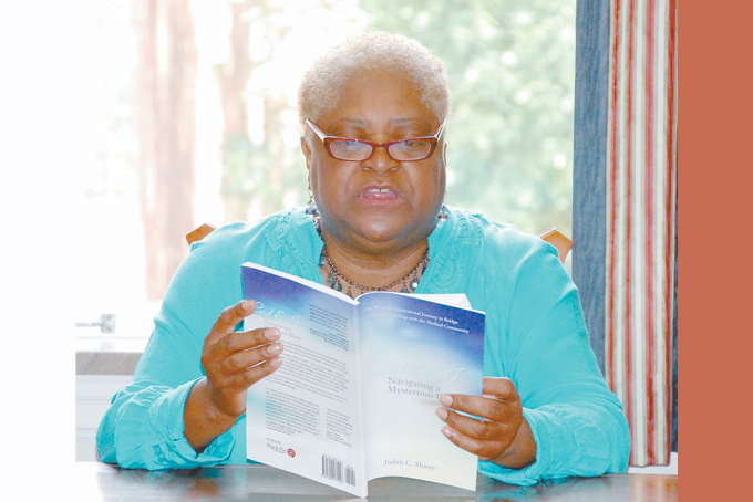 SPREADING THE WORD—Rev. Dr. Judith C. Moore a woman of many hats is ready to share from her recently released book. (Photos by Diane I. Daniels) 