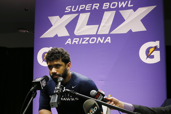 Seattle Seahawks quarterback Russell Wilson (3) speaks during a news conference after the NFL Super Bowl XLIX football game against the New England Patriots Sunday, Feb. 1, 2015, in Glendale, Ariz. The Patriots won 28-24. (AP Photo/Matt York)