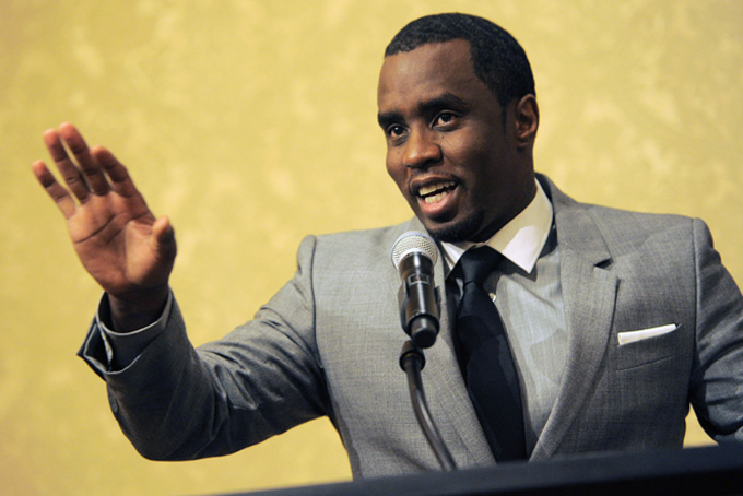 In this July 26, 2013 file photo, Sean "Diddy" Combs of the new network Revolt TV addresses reporters at the Beverly Hilton Hotel in Beverly Hills, Calif. Police say an Arizona man is accusing hip-hop mogul Combs of punching him in the face at a Super Bowl party. Sgt. Ben Hoster of the Scottsdale Police Department said Thursday, Feb. 5, 2015, that Steven Donaldson cussed at the rapper for not performing at the party, drawing the punch.  (Photo by Chris Pizzello/Invision/AP, File)