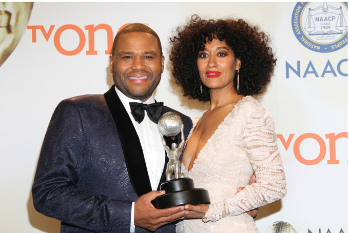 Anthony Anderson, left, and Tracee Ellis Ross pose in the press room with the award for outstanding comedy series for "Black-ish" at the 46th NAACP Image Awards at the Pasadena Civic Auditorium on Friday, Feb. 6, 2015, in Pasadena, Calif. (Photo by Arnold Turner/Invision/AP)