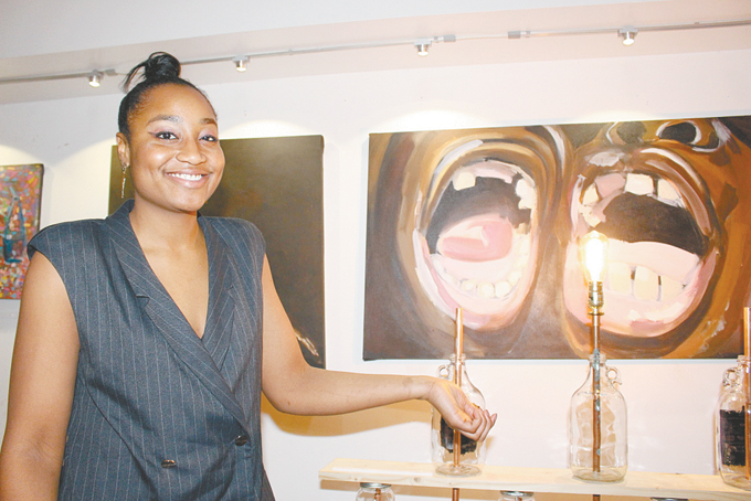 UNIQUE ART—Naomi Walker showing off some of her artwork. 