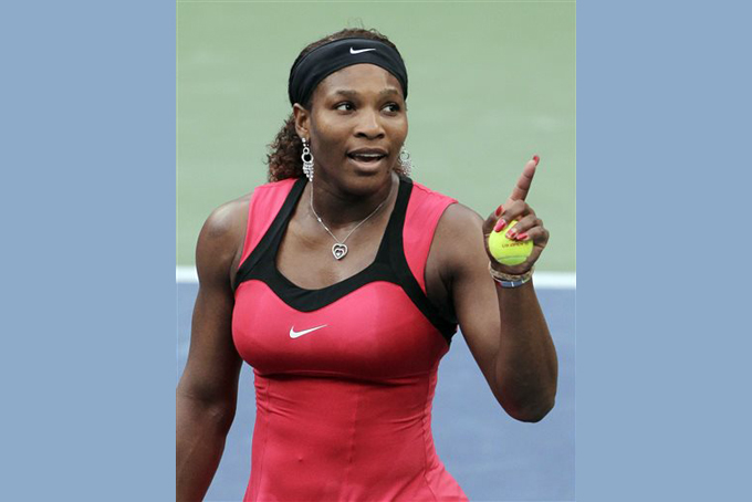 In this Sept. 11, 2011, file photo, Serena Williams gestures while talking to the chair umpire Eva Asderaki during the women's championship match at the U.S. Open tennis tournament in New York. Williams says she will return to play in the tournament at Indian Wells, California next month after boycotting the event for 14 years. In an exclusive column for time.com, Williams writes about the jeering and booing and an 'undercurrent of racism" she felt during the 2001 semifinal and final. (AP Photo/Mike Groll, File)