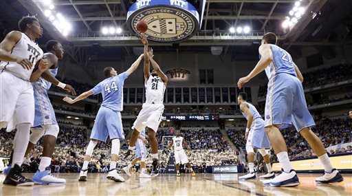 Pittsburgh's Sheldon Jeter (21) shoots over North Carolina's Justin Jackson (44) during the first half of an NCAA college basketball game, Saturday, Feb. 14, 2015, in Pittsburgh. (AP Photo/Keith Srakocic)
