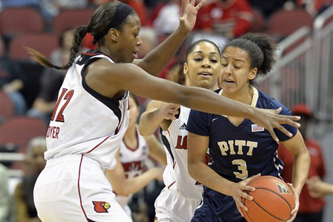Pittsburgh's Brianna Kiesel, right, is trapped by the defense of Louisville's Shawnta' Dyer, left, and Bria Smith during the first half of an NCAA college basketball game Sunday, Feb. 8, 2015 in Louisville, Ky. Louisville won 48-35. (AP Photo/Timothy D. Easley)