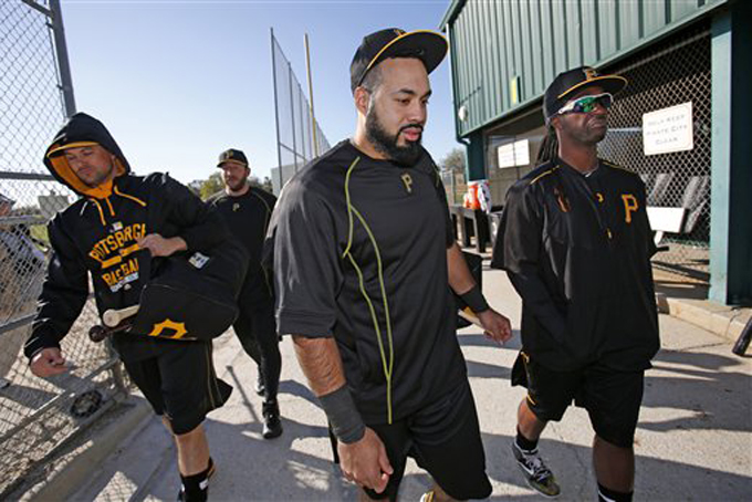 Pittsburgh Pirates' Pedro Alvarez, center, and Andrew McCutchen, right, and Jordy Mercer, left, head to the batting cages during an informal spring training baseball workout in Bradenton, Fla., Thursday, Feb. 19, 2015. Pirates pitchers and catcher get underway with the first official workout of the spring this afternoon. (AP Photo/Gene J. Puskar)