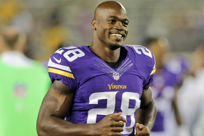 In this Aug. 8, 2014, file photo, Minnesota Vikings running back Adrian Peterson leaves the field after an NFL preseason football game against the Oakland Raiders in Minneapolis. A federal judge has cleared the way for Peterson to be reinstated. U.S. District Judge David Doty issued his order Thursday, Feb. 26, 2015, less than three weeks after hearing oral arguments. AP Photo/Jim Mone, File)