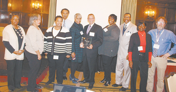 WINNING NEWSPAPER—New Pittsburgh Courier staff members with its Pennsylvania NewsMedia Association Foundation 2014 Newspaper of the Year for Weeklies award. It was just one of the 11 awards won that day. Pictured from left, Diane Daniels, Allison Palm, Kathleen Neely, Ulish Carter, Debbie Norrell, Rod Doss, Ashley Johnson, Eric Gaines, Brenda Hill and Christian Morrow. (Photo by J.L. Martello)