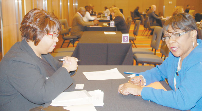 MATCH MAKING—Ruth Byrd-Smith, Allegheny County Department of M/W/DBE director, shares information with Mary Coffee owner of All Purpose Cleaning Services, Inc.