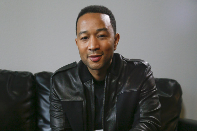 John Legend poses for a photograph during the SXSW Music Festival on Saturday, March 21, 2015 in Austin, Texas. (Photo by Jack Plunkett/Invision/AP)