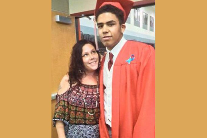 19-year-old Tony Robinson pictured with his mother, Andrea Irwin. Robinson, an unarmed Black 19-year-old, was fatally shot Friday, by Matt Kenny, a White police officer, the Madison police chief said Saturday, March 7, 2015.(Facebook Photo)