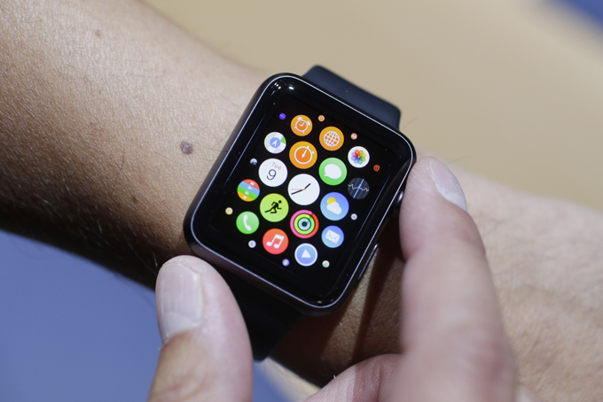 In this Sept. 9, 2014 file photo, the new Apple Watch is modeled during a media event in Cupertino, Calif. Apple CEO Tim Cook has hinted the wearable gadget will be as game-changing as Apple’s revolutionary iPhones and iPads, which have become indispensable accessories for millions around the globe. (AP Photo/Marcio Jose Sanchez, File)
