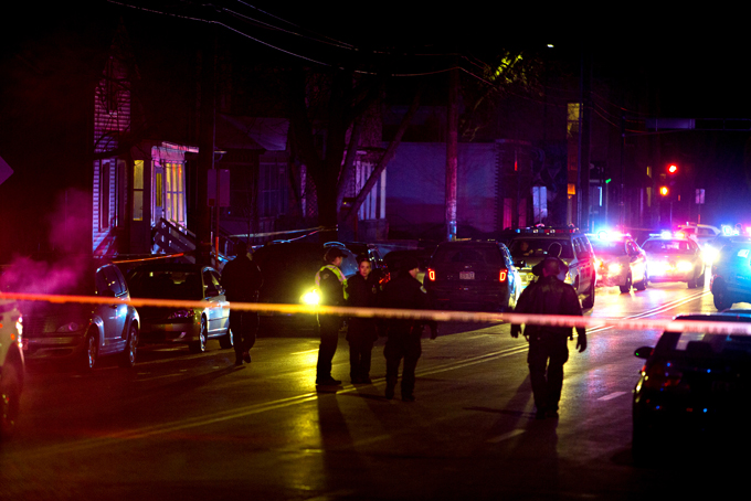 Madison Police investigate the scene of a shooting on Williamson Street, late Friday, March 6, 2015 in Madison, Wis.  A 19-year-old black man died Friday night after being shot by an officer in Madison, authorities said. The man was shot after an altercation with the officer and died at a hospital, Police Chief Mike Koval said. He did not know if the man was armed, but said the "initial findings at the scene did not reflect a gun or anything of that nature that would have been used by the subject.  (AP Photo/Wisconsin State Journal, Steve Apps)