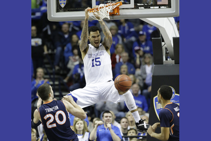 Kentucky forward Willie Cauley-Stein (15) dunks the ball as Auburn forward Alex Thompson (20) and Auburn guard Devin Waddell look on during the second half of an NCAA college basketball game in the semifinal round of the Southeastern Conference tournament, Saturday, March 14, 2015, in Nashville, Tenn. (AP Photo/Mark Humphrey)