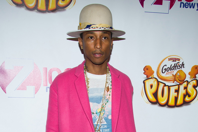 In this Dec. 12, 2014 file photo, Pharrell Williams poses in the Z100 Jingle Ball press room at Madison Square Garden in New York.  (Photo by Charles Sykes/Invision/AP, File)