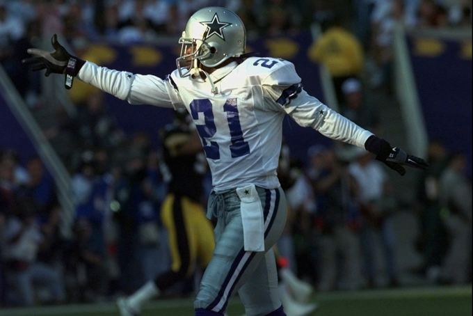 In this Jan. 28, 1996, file photo, Dallas Cowboys' Deion Sanders celebrates during first quarter play against the Pittsburgh Steelers at Super Bowl XXX in Tempe, Ariz. The Defensive Player of the Year helped San Francisco win the 1995 Super Bowl, then cashed in with a seven-year, $35 million deal with the Dallas Cowboys the next year.(AP Photo/Susan Ragan, File)