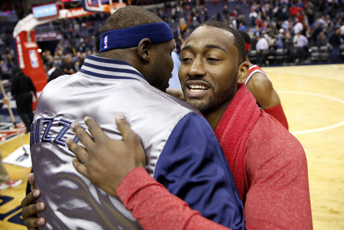Memphis Grizzlies forward Zach Randolph (50) embraces Washington Wizards guard John Wall (2) after an NBA basketball game Thursday, March 12, 2015, in Washington. The Wizards won 107-87. (AP Photo/Alex Brandon)
