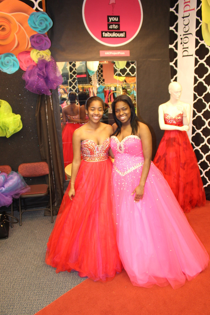 PRINCESSES-From left, Indyha Fielder and Cleandra Williams show off the dresses they selected during the 2015 Project Prom giveaway. (Photos by J.L. Martello)