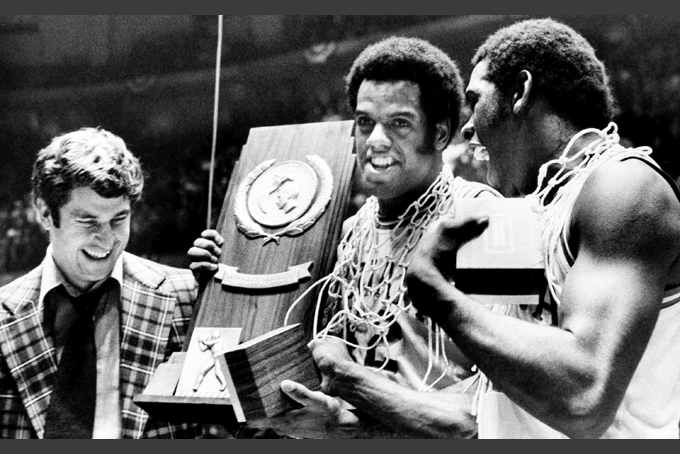 In this March, 1976, file photo, Indiana coach Bobby Knight, left, and team members Scott May, center, and Quinn Buckner right, celebrate with the trophy after winning the NCAA Basketball Championship in Philadelphia on Monday, March 30, 1976.  (AP Photo, File)