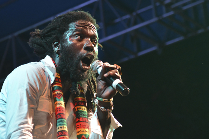 In this Feb. 18, 2015 photo, Jamaican singer Jah Bouks, whose given name is Warin Smith, entertains the crowd at a show organized by the Jamaica Reggae Industry Association during the island's "reggae month," in Kingston, Jamaica.  (AP Photo/David McFadden)