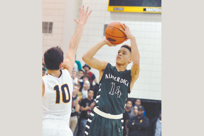 LEADING THE WAY—Allderdice’s Tim Jackson scored 28 points to lead the Dragons to a 60-57 win over Mt Lebanon in the PIAA Class AAAA playoffs, “The Dice” moved on to defeat Harrisburg 65—58 March 7. They play Martin Luther King School, March 17. (Photo by William McBRide)