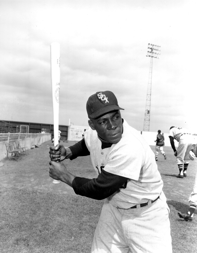 In a March 9, 1957 file photo, Chicago White Sox outfielder Orestes "Minnie" Minoso poses in batting position at Al Lopez Field in Tampa, Fla. Major league baseball's first black player in Chicago, Minnie Minoso, has died. The Cook County medical examiner confirmed his death Sunday, March 1, 2015. There is some question about his age but the White Sox say he was 92. (AP Photo, File)