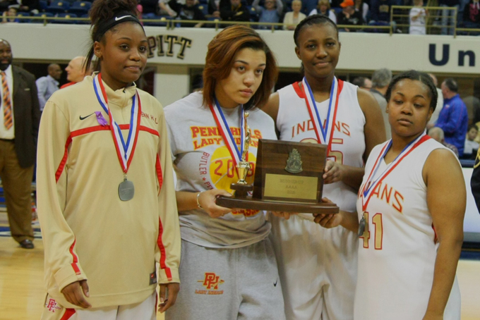 Penn Hills senior players from left, Marlon Herring, Jade Reese, Baylea Anderson and Jasmine Baxter accept the runner up trophy after losing to Norwin in the WPIAL Class AAAA championship game, it was the first time in 20 years the Penn Hills girls played in the championship game. (Courier Photo/William McBride)