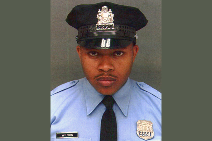 This undated photo provided by Philadelphia Police Department, shows Robert Wilson III. Wilson, a Philadelphia police officer, was shot in the head and killed after he and his partner exchanged gunfire with two suspects trying to rob a video game store, city officials said Thursday, March 5, 2015. (AP Photo/Philadelphia Police Department)