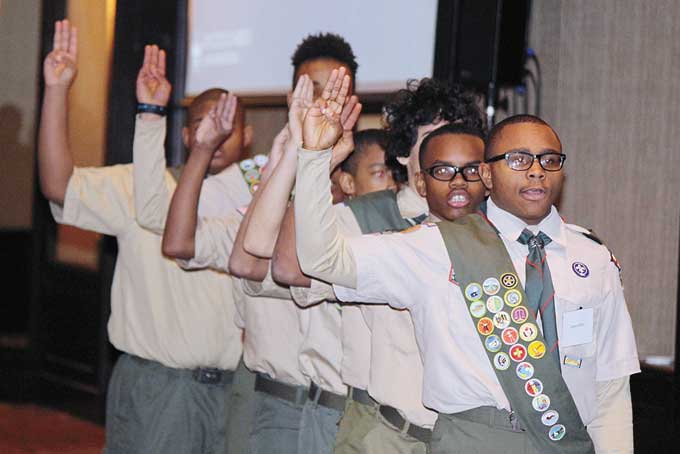 SCOUT’S HONOR—Scouts from troops 281, 348, 760, 646, took part in the evening’s opening ceremonies. These members pictured above, raise their right hands while reciting the scout pledge. (Photos by J.L. Martello)