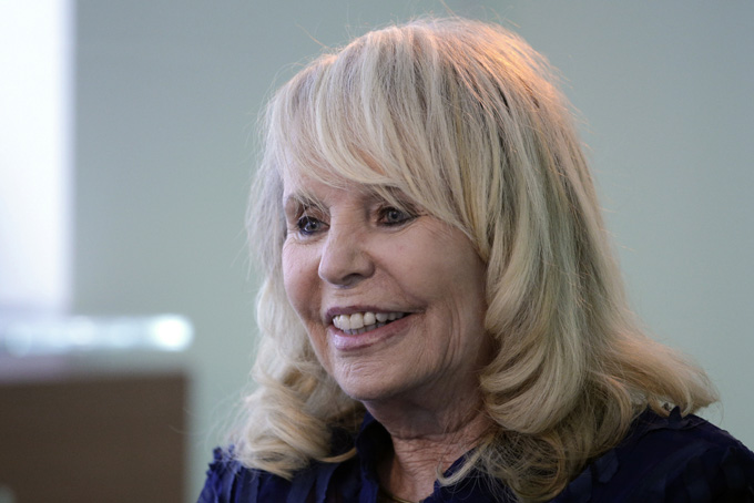 In this Aug. 28, 2014, file photo, Shelly Sterling, wife of former Los Angeles Clippers owner Donald Sterling, smiles during an interview in Los Angeles. (AP Photo/Jae C. Hong, File)   