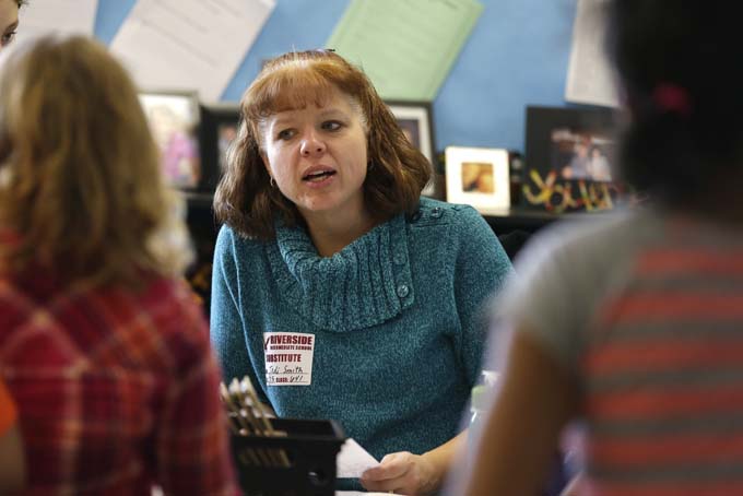 In this Thursday, Feb. 5, 2015 photo, substitute teacher Jodi Smith teaches a fifth grade class at Riverside Intermediate School in Fishers, Ind. (AP Photo/Michael Conroy)