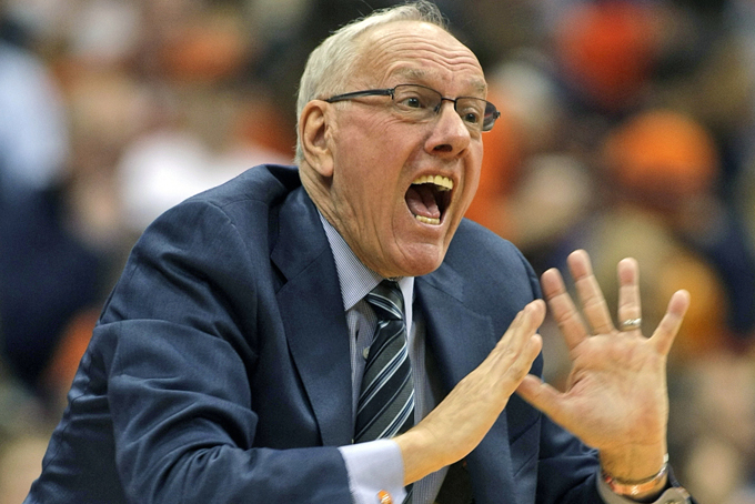 In this Dec. 6, 2014, file photo, Syracuse head coach Jim Boeheim yells to his players in the second half of an NCAA college basketball game against St. John’s in Syracuse, N.Y. The NCAA has suspended Syracuse coach Jim Boeheim Friday, March 6, 2015, for nine games for academic, drug and gifts violations committed primarily by the men's basketball program.(AP Photo/Nick Lisi, File)