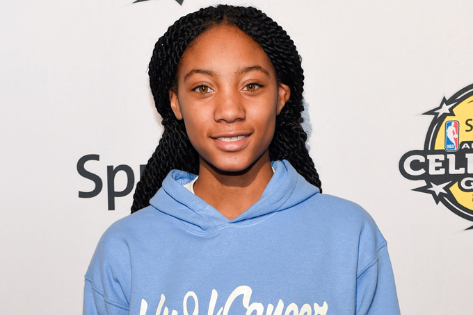 In this Feb. 13, 2015 file photo, Mo'ne Davis attends the 2015 Sprint NBA All-Star Celebrity Game at Madison Square Garden in New York. The Disney Channel says development is under way on the biographical film, titled "Throw Like Mo." It will tell the story of this 13-year-old sensation who last summer made history as the first girl to pitch a shutout in the Little League World Series.  (Photo by Scott Roth/Invision/AP, File)