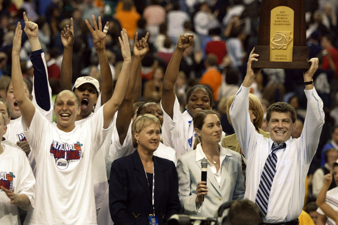 In this April 8, 2003, file photo,  Connecticut head coach Geno Auriemma, right, and guard Diana Taurasi, left, celebrate their 73-68 win over Tennessee in the NCAA Women's Final Four championship game in Atlanta.  (AP Photo/Chuck Burton, File)