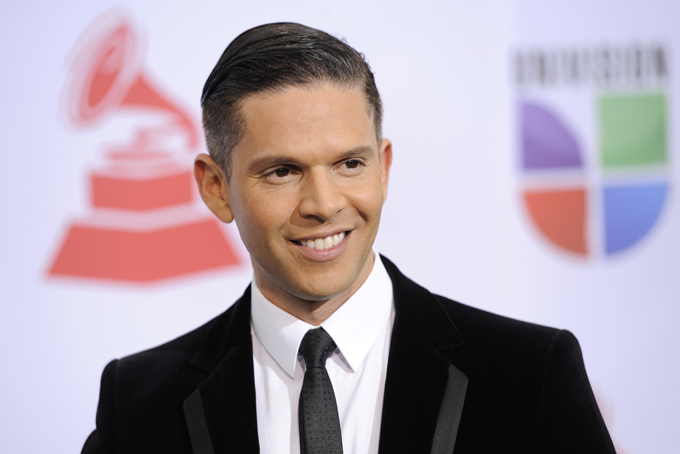 In this Nov. 10, 2011, file photo, Rodner Figueroa arrives at the 12th Annual Latin Grammy Awards in Las Vegas. Univision announced Thursday, March 12, 2015, that Figueroa has been fired after making unacceptable remarks about U.S. First Lady Michelle Obama. (AP Photo/Chris Pizzello)