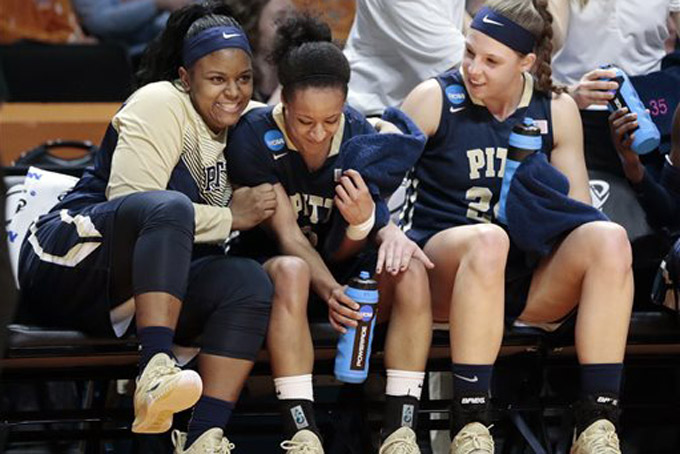 Pittsburgh players Brittany Gordon, left, Brianna Kiesel, center, and Monica Wignot, right, celebrate in the final seconds of the second half of an NCAA women's college basketball tournament game against Chattanooga, Saturday, March 21, 2015, in Knoxville, Tenn. Pittsburgh won 51-40. (AP Photo/Mark Humphrey)
