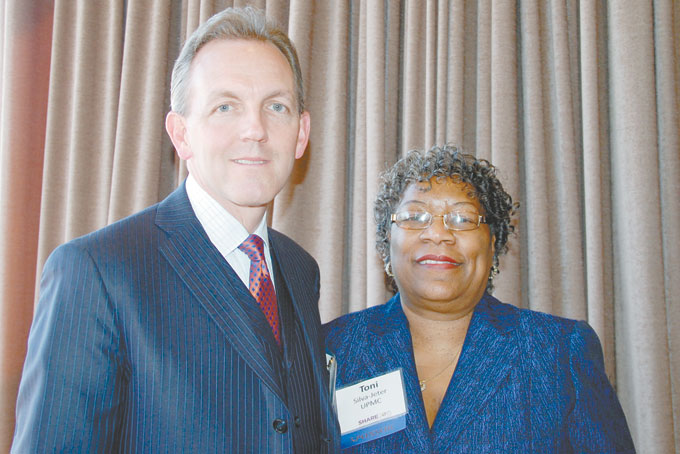 WHAT A TEAM—Rob DeMichiei, executive vice president and chief financial officer and Toni Y. Silva, director, supplier relations both at UPMC view Share 2015 as a success. (Photos by Diane I. Daniels)