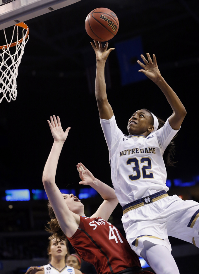In this March 27, 2015, file photo, Notre Dame guard Jewell Loyd (32) shoots over Stanford forward Bonnie Samuelson (41) during the second half of a women's college basketball regional semifinal game in the NCAA Tournament in Oklahoma City. Loyd was selected to the AP All-America team, Tuesday, March 31, 2015. (AP Photo/Sue Ogrocki, File)